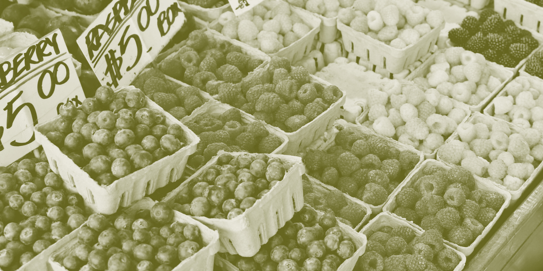 Punnets of fresh berries for sale at a market stall
